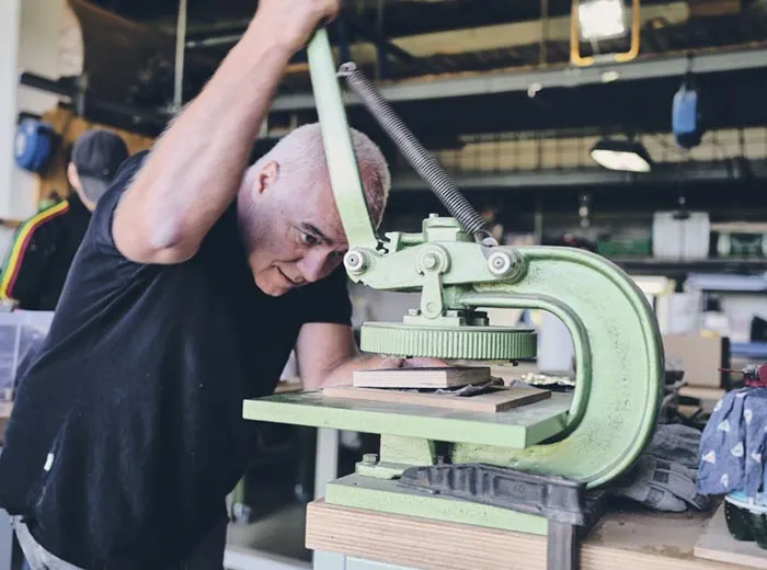 Engineer working on a press in the workshop